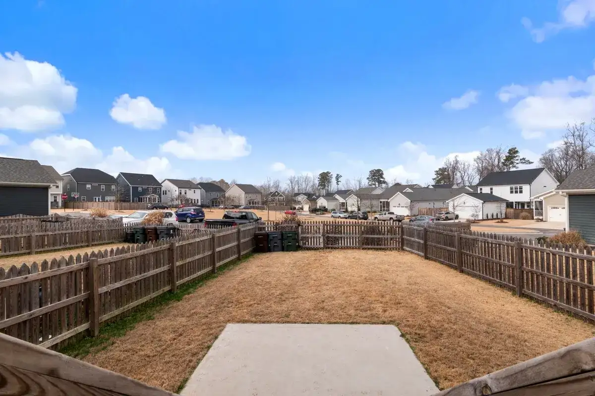 Newly installed wood privacy fences around backyards in a residential neighborhood