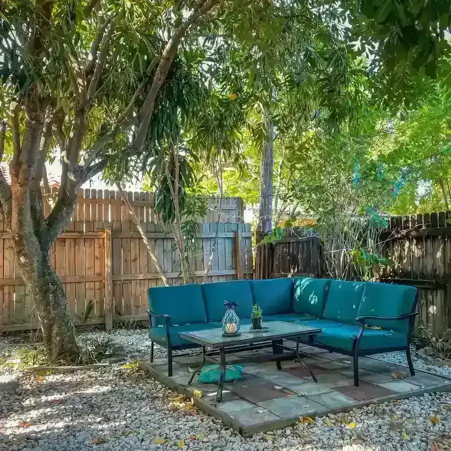 Florida backyard patio enclosed by a wood privacy fence